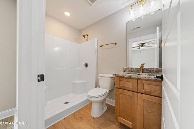 72 S Greensboro Rd, Southport, NC 28461 - bathroom with vanity, wood finished floors, a shower, and a ceiling fan