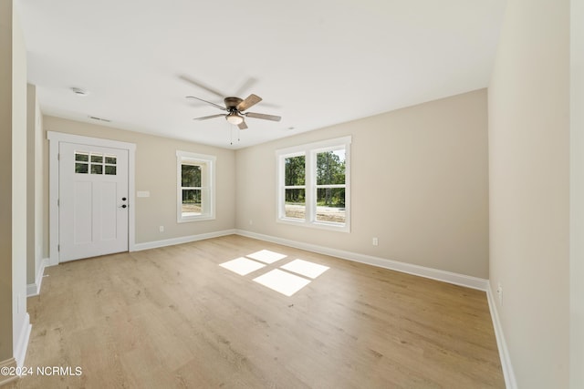 72 S Greensboro Rd, Southport, NC 28461 - empty room featuring a ceiling fan and light wood-type flooring