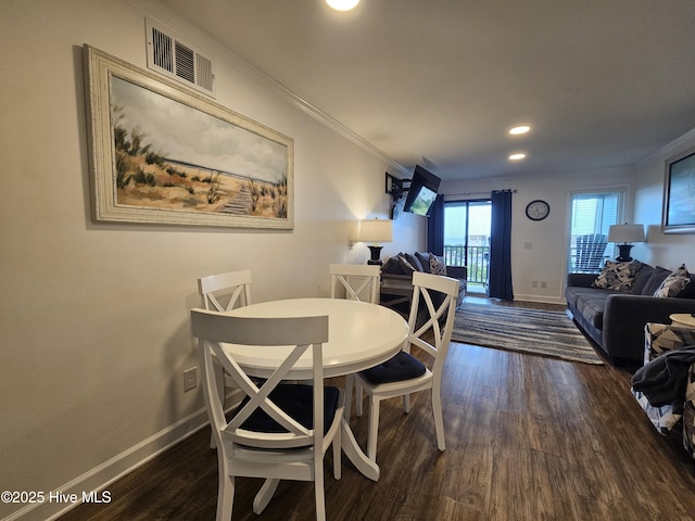 2008 E Ft Macon Rd Unit E14, Atlantic Beach, NC 28512 - dining area with ornamental molding, dark wood-style flooring, and recessed lighting