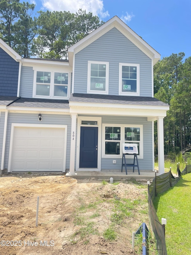804 Palm Frond Way, Calabash, NC 28467 - view of front of house with covered porch and a garage