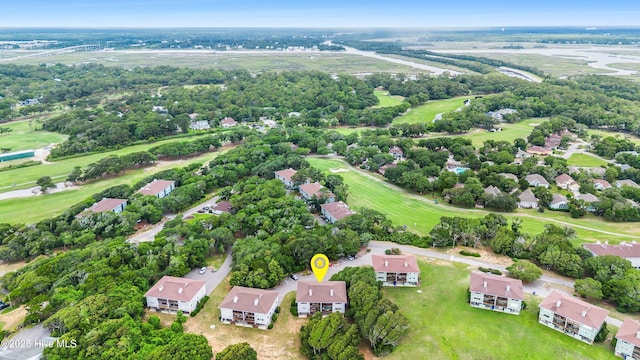 11 Foxfire Trce, Oak Island, NC 28465 - aerial perspective of suburban area featuring a tree filled landscape