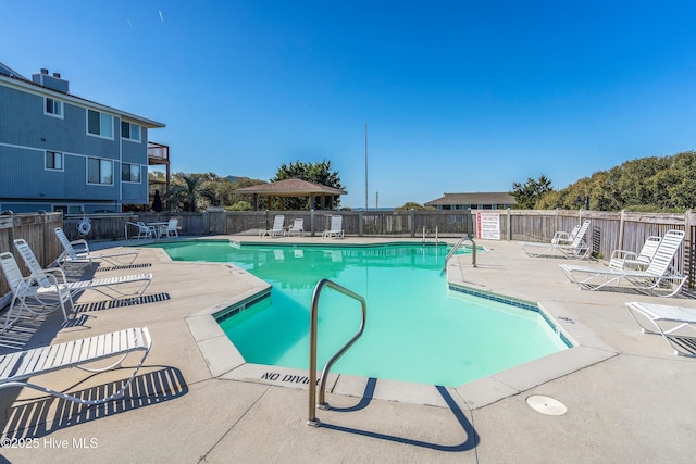 11 Foxfire Trce, Oak Island, NC 28465 - community pool featuring a patio
