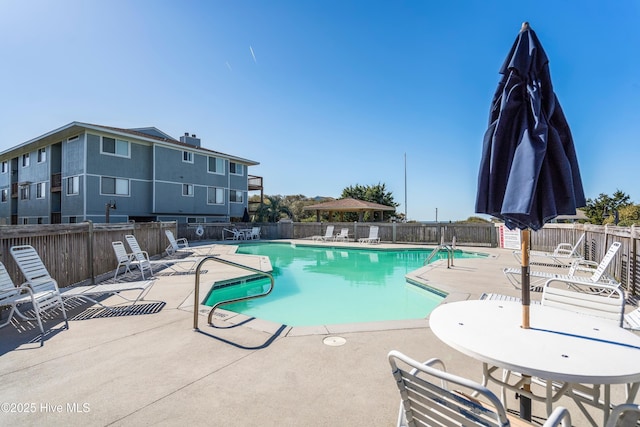 11 Foxfire Trce, Oak Island, NC 28465 - community pool featuring a patio
