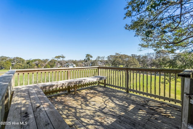 11 Foxfire Trce, Oak Island, NC 28465 - deck with view of scattered trees and a yard