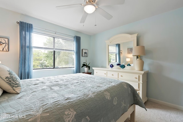 11 Foxfire Trce, Oak Island, NC 28465 - bedroom with carpet flooring, multiple windows, and ceiling fan