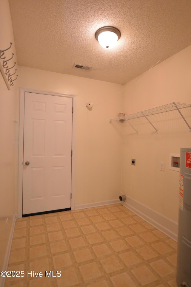 140 Van Riggs Rd, Hubert, NC 28539 - washroom with a textured ceiling, electric dryer hookup, electric water heater, and washer hookup