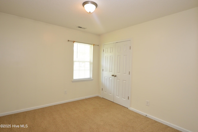 140 Van Riggs Rd, Hubert, NC 28539 - unfurnished bedroom with light colored carpet and a closet