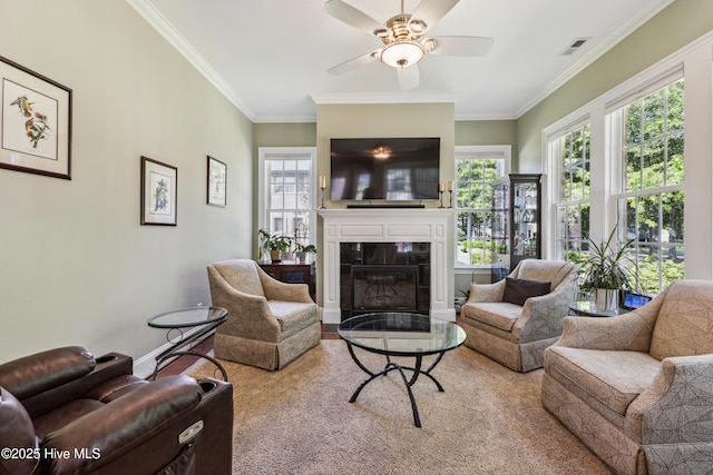 8812 Fazio Dr, Wilmington, NC 28411 - living room featuring crown molding, ceiling fan, a fireplace, and carpet floors