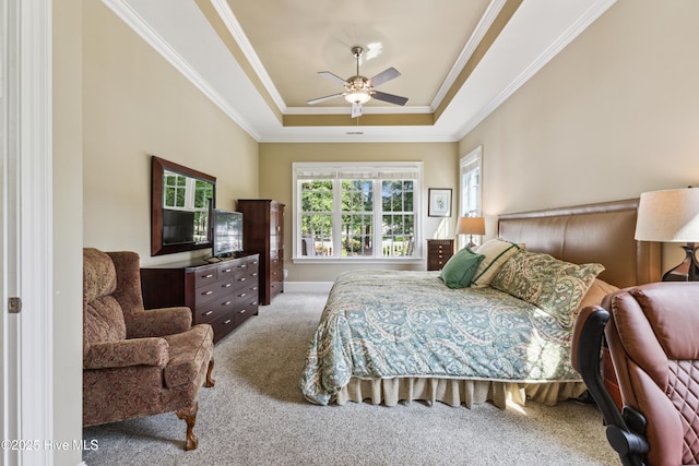 8812 Fazio Dr, Wilmington, NC 28411 - bedroom featuring carpet, crown molding, a raised ceiling, and a ceiling fan