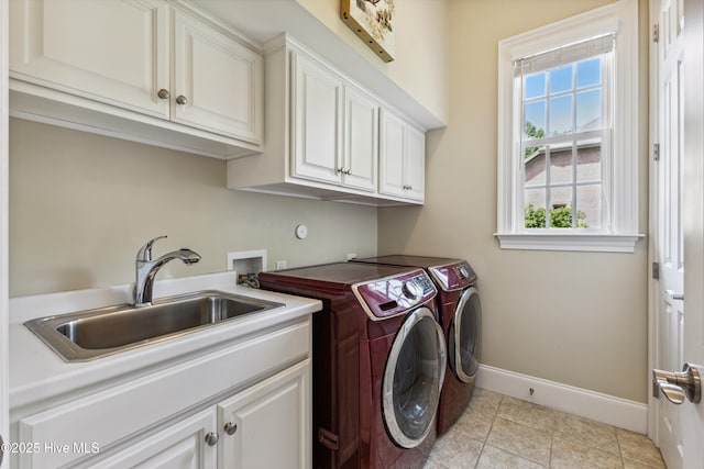 8812 Fazio Dr, Wilmington, NC 28411 - laundry area with cabinet space, washer and dryer, and light tile patterned flooring