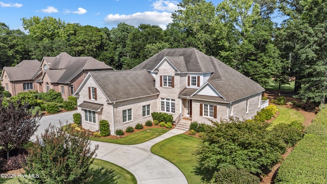 8812 Fazio Dr, Wilmington, NC 28411 - view of front of house with curved driveway and brick siding