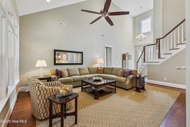 8812 Fazio Dr, Wilmington, NC 28411 - living room featuring high vaulted ceiling, wood finished floors, stairs, and a ceiling fan