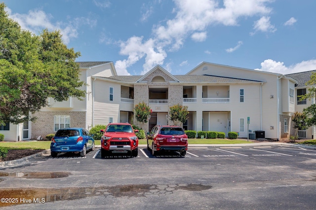 213 Fullford Ln Unit 201, Wilmington, NC 28412 - view of building exterior featuring uncovered parking