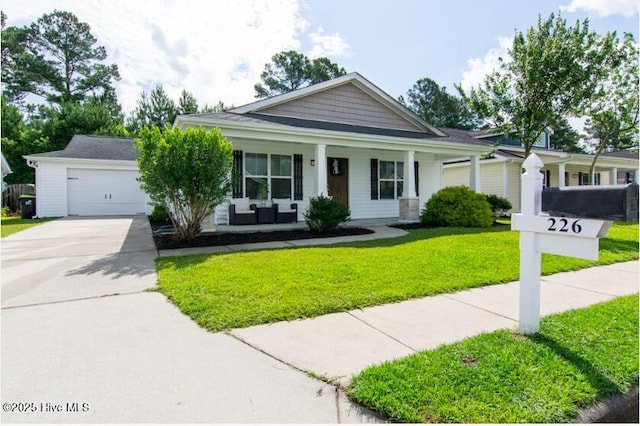 226 Bandon Dr, New Bern, NC 28562 - view of front of home featuring a front yard, concrete driveway, and a porch