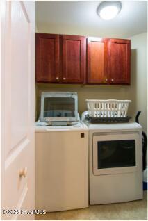 226 Bandon Dr, New Bern, NC 28562 - washroom featuring washing machine and dryer and cabinet space