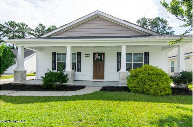 226 Bandon Dr, New Bern, NC 28562 - view of front of property featuring covered porch and a front lawn