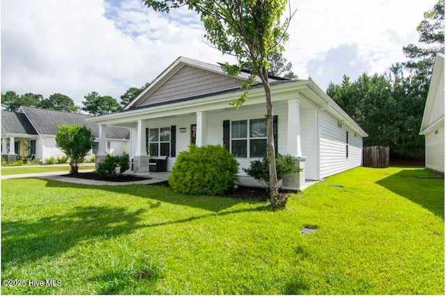 226 Bandon Dr, New Bern, NC 28562 - view of front of home with covered porch and a front lawn