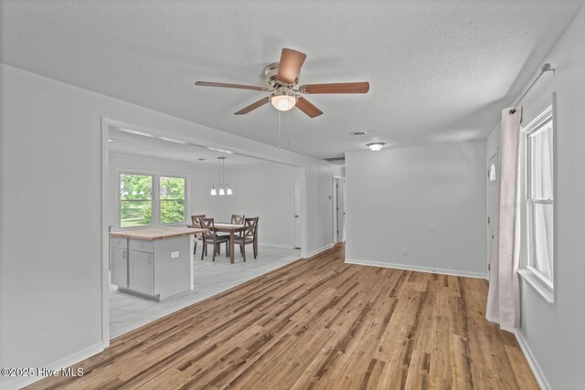 1292 Lake Cole Rd, Midway Park, NC 28544 - unfurnished room featuring light wood-style floors, a ceiling fan, and a textured ceiling