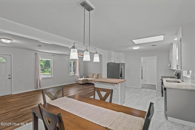 1292 Lake Cole Rd, Midway Park, NC 28544 - dining room with a skylight and light marble finish floors