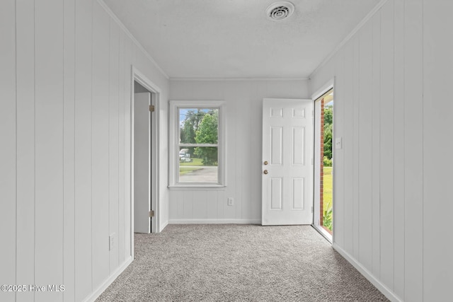 1292 Lake Cole Rd, Midway Park, NC 28544 - entryway with ornamental molding, carpet floors, and wooden walls