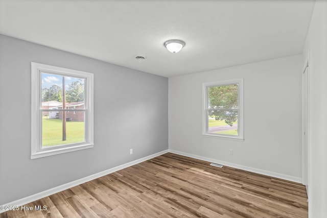 1292 Lake Cole Rd, Midway Park, NC 28544 - empty room featuring plenty of natural light and light wood-type flooring