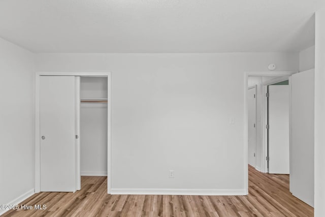 1292 Lake Cole Rd, Midway Park, NC 28544 - unfurnished bedroom featuring wood finished floors and a closet