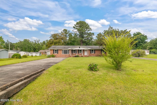 1292 Lake Cole Rd, Midway Park, NC 28544 - ranch-style house featuring asphalt driveway, brick siding, and a front yard