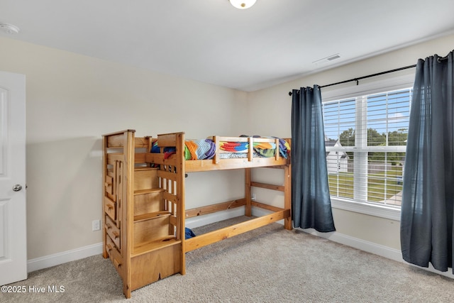 324 Windmill Light Way, Sneads Ferry, NC 28460 - carpeted bedroom with baseboards