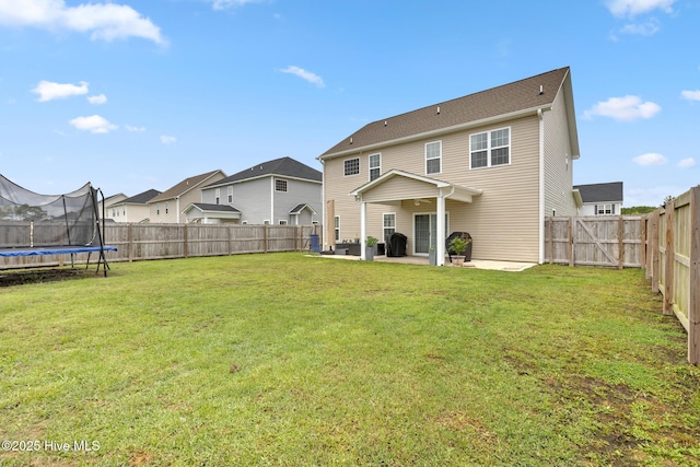 324 Windmill Light Way, Sneads Ferry, NC 28460 - back of property featuring a patio, a trampoline, a fenced backyard, and a residential view