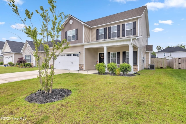 324 Windmill Light Way, Sneads Ferry, NC 28460 - traditional-style house with concrete driveway, covered porch, board and batten siding, an attached garage, and a gate