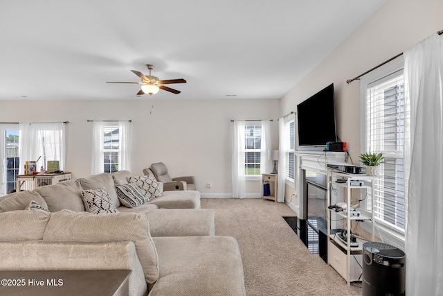 324 Windmill Light Way, Sneads Ferry, NC 28460 - living room featuring a fireplace with flush hearth, carpet floors, and ceiling fan