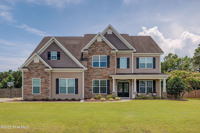 110 E Conolly Ct, Hampstead, NC 28443 - craftsman house with stone siding, french doors, and a shingled roof