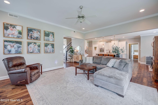 110 E Conolly Ct, Hampstead, NC 28443 - living area featuring ceiling fan, stairs, dark wood-style flooring, ornamental molding, and recessed lighting