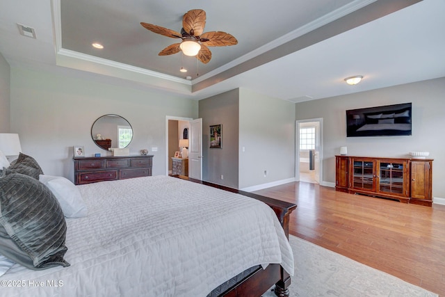 110 E Conolly Ct, Hampstead, NC 28443 - bedroom featuring wood finished floors, ornamental molding, a tray ceiling, ceiling fan, and recessed lighting