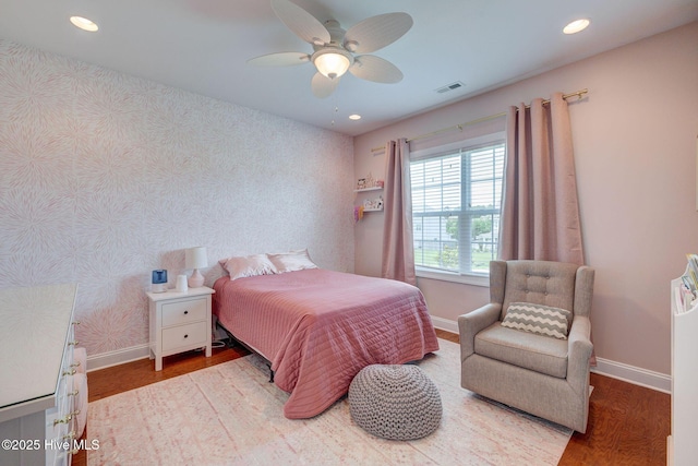 110 E Conolly Ct, Hampstead, NC 28443 - bedroom with wood finished floors, wallpapered walls, recessed lighting, and a ceiling fan