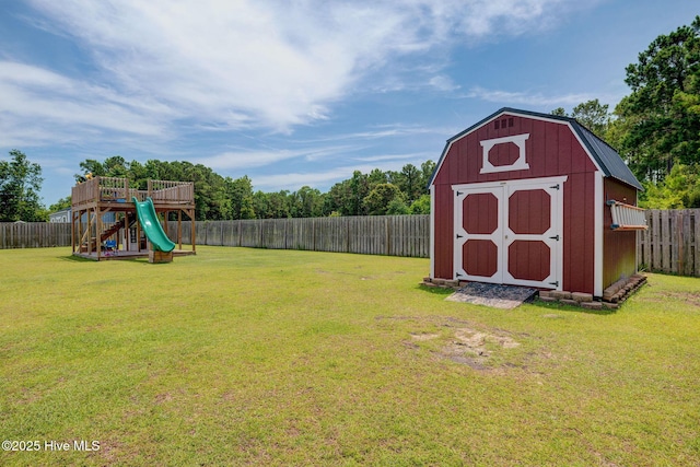 110 E Conolly Ct, Hampstead, NC 28443 - fenced backyard with a playground and a storage unit