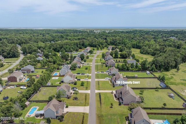 110 E Conolly Ct, Hampstead, NC 28443 - view of property location with a heavily wooded area and nearby suburban area