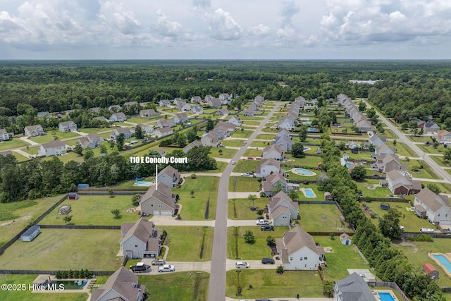 110 E Conolly Ct, Hampstead, NC 28443 - aerial view of residential area with a heavily wooded area