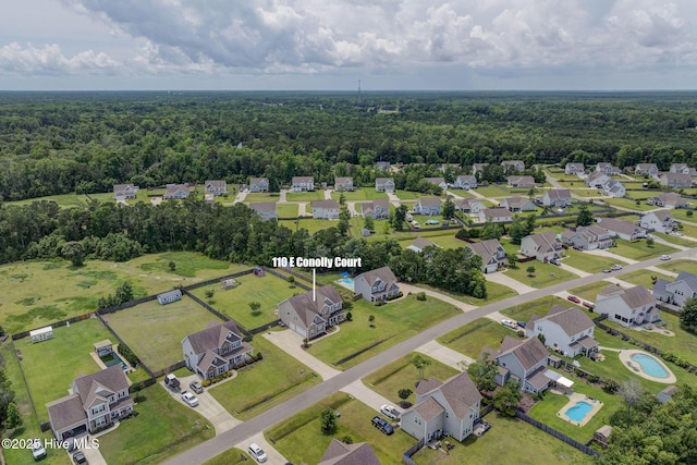 110 E Conolly Ct, Hampstead, NC 28443 - aerial overview of property's location featuring a heavily wooded area and nearby suburban area