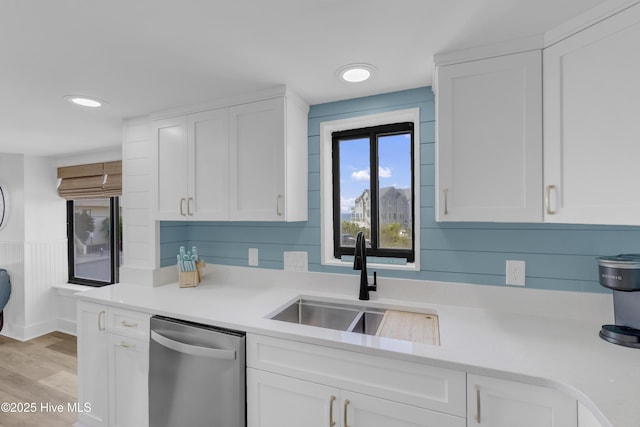 8801 Reed Dr Unit 116West, Emerald Isle, NC 28594 - kitchen with dishwasher, light countertops, white cabinetry, light wood-type flooring, and recessed lighting