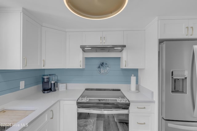 8801 Reed Dr Unit 116West, Emerald Isle, NC 28594 - kitchen with stainless steel appliances, under cabinet range hood, light countertops, and white cabinets