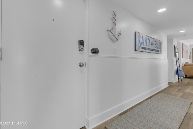 8801 Reed Dr Unit 116West, Emerald Isle, NC 28594 - hall featuring wood finished floors, recessed lighting, and a wainscoted wall
