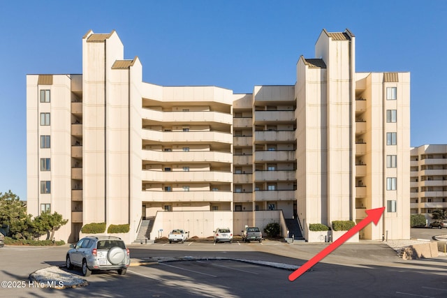 8801 Reed Dr Unit 116West, Emerald Isle, NC 28594 - view of building exterior featuring uncovered parking
