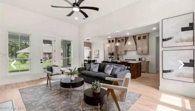 209 Planters Ridge Dr, Sunset Beach, NC 28468 - living area with a ceiling fan and light wood finished floors