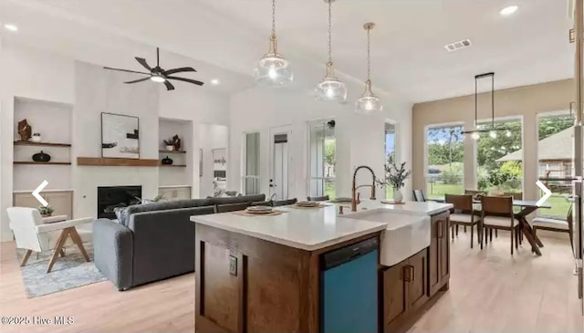 209 Planters Ridge Dr, Sunset Beach, NC 28468 - kitchen featuring dishwashing machine, light wood-style floors, light countertops, ceiling fan, and recessed lighting