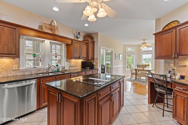2710 Scarborough Way, Southport, NC 28461 - kitchen featuring dishwasher, ceiling fan, black electric cooktop, light tile patterned floors, and recessed lighting