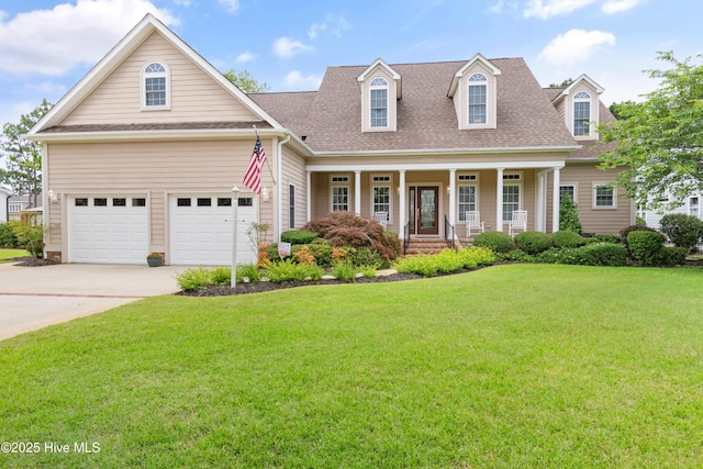 2710 Scarborough Way, Southport, NC 28461 - view of front of house featuring a front lawn, concrete driveway, a porch, and roof with shingles