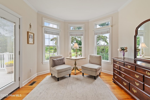 2710 Scarborough Way, Southport, NC 28461 - sitting room with healthy amount of natural light, crown molding, and light wood-style floors