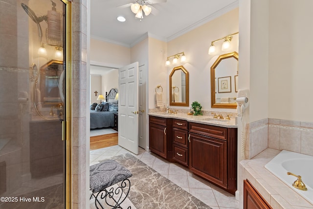 2710 Scarborough Way, Southport, NC 28461 - ensuite bathroom featuring double vanity, a stall shower, crown molding, a garden tub, and tile patterned flooring