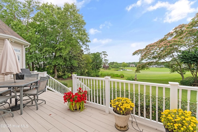 2710 Scarborough Way, Southport, NC 28461 - wooden terrace featuring outdoor dining space, golf course view, and a lawn